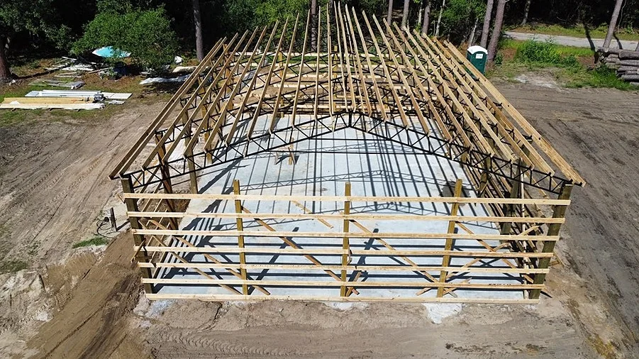 Wood-framed building under construction from the official website